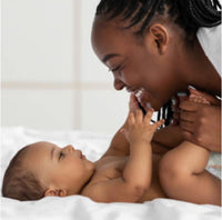 mother playing with baby