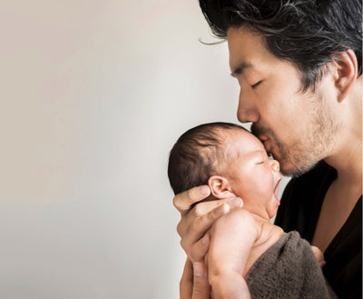 Father kissing a baby