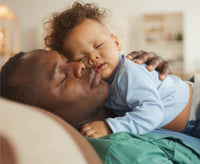 Sleeping father and baby